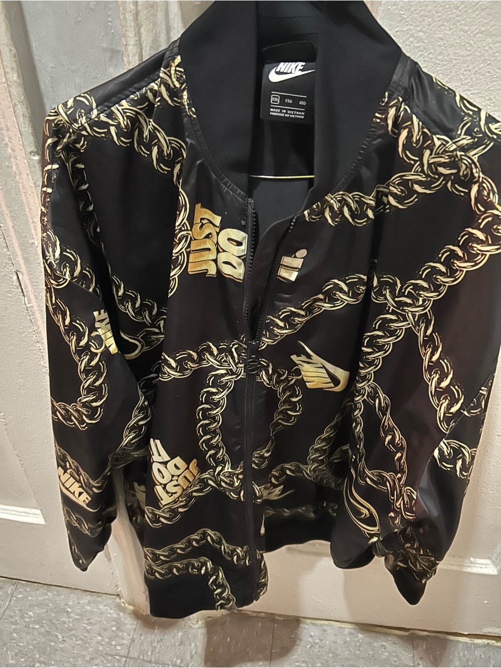 Nike Black Bomber Jacket with Gold Chain Print